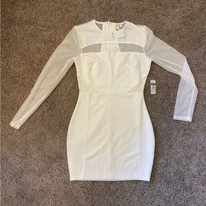 White long sleeve dress. Tags on never worn